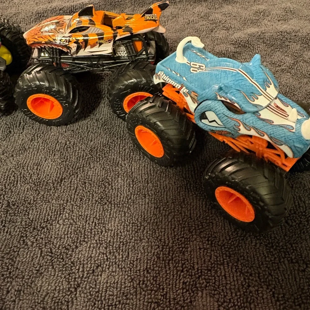 Hot Wheels 4 lot of Monster Truck Toys. Assorted Colors (Green, Orange, Blue)